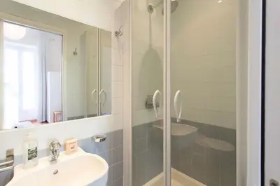 a bathroom with a sink and a shower at #27 Urban Suite AC 2 Bedrooms 10mins Walk Sea&Old Town in Nice