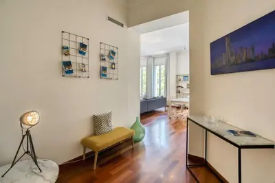 a living room with a table and a chair at #27 Urban Suite AC 2 Bedrooms 10mins Walk Sea&Old Town in Nice