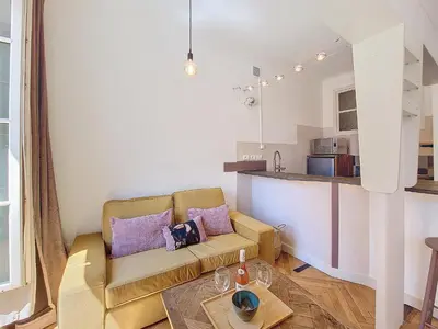 a living room with a couch and a table at Nestor&Jeeves - CITY TRIP - Central - Balcony in Nice