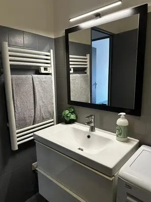a bathroom with a sink and a mirror at Californie in Nice