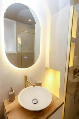 a bathroom with a sink and a mirror at Nice carré d'or proche Negresco in Nice