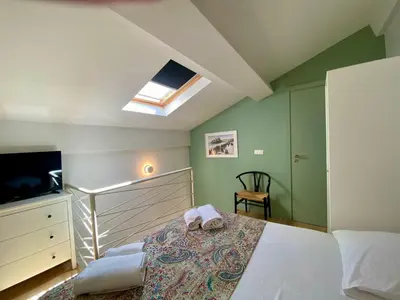 a bedroom with a bed and a skylight at Studio Beautes FSHH in Nice