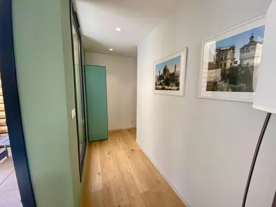 a hallway with two pictures on the wall at Studio Beautes FSHH in Nice