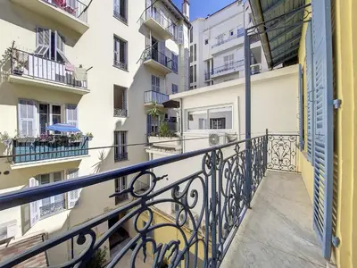 a balcony of a building with balconies anditures at Nestor&Jeeves - BRISE DE NICE - Balcony - Central in Nice