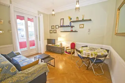 a living room with a couch and a table at Villa Rivoli City Center Nice in Nice