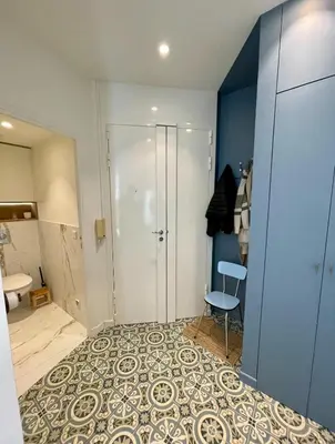a room with a shower and a chair in it at Bright, Spacious 2 Bedroom Apartment, Walk to Beach & Old Town in Nice