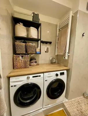 a laundry room with a washer and dryer at Bright, Spacious 2 Bedroom Apartment, Walk to Beach & Old Town in Nice