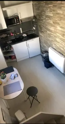 an overhead view of a kitchen with a table and a counter at appartement proche centre ville in Nice