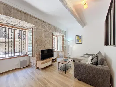 a living room with a couch and a tv at Nestor&Jeeves - VILLA FAY - Near Beach - Promenade in Nice