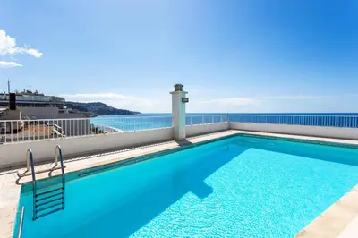 a swimming pool on the roof of a building at Royal Luxembourg AP4397 By Riviera Holiday Homes in Nice