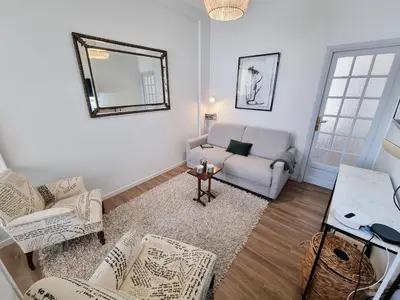 a living room with a couch and a chair at 