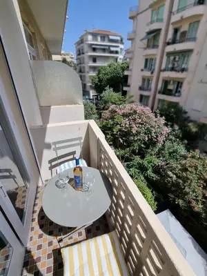 a white table and chairs on a balcony at 