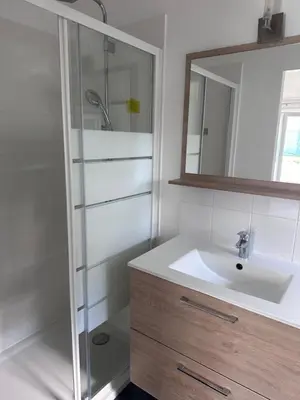 a bathroom with a sink and a glass shower at appartement au calme avec jardin privatif dans maison in Cagnes-sur-Mer