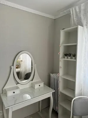 a white dressing table with a mirror and a chair at Anahit in Nice