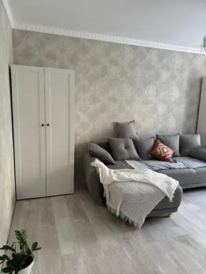 a bedroom with a bed and a cabinet at Anahit in Nice