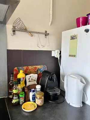 a kitchen counter top with various items on it at Studio style vintage à Nice in Nice
