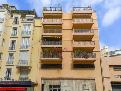 a tall building with balconies and flowers on it at Studio Le Maréchal by Interhome in Nice