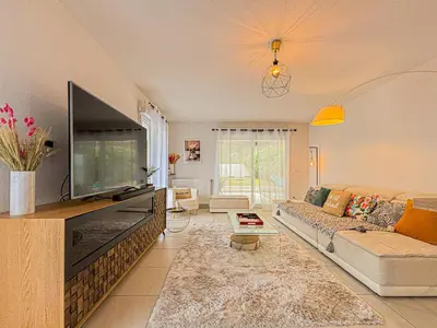 a living room with a large flat screen tv at Canta Galet - Wifi, AC, Parking, 4pers in Nice
