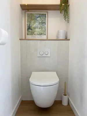 a bathroom with a white toilet in a room at Appartement - Proche plage & gare in Cagnes-sur-Mer
