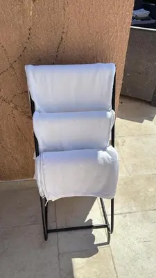 a white chair sitting in front of a wall at Calm#Child friendly#Home#Beach#Airport in Saint-Laurent-du-Var