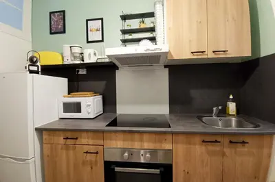 a small kitchen with a sink and a microwave at Charming T2 apartment in Nice city center in Nice