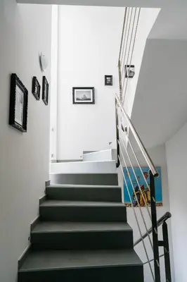 a staircase in a house with green stairs at Prestigieuse Villa De Crémat Nice in Nice