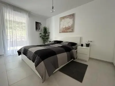a bedroom with a large bed and a window at Fabron Hills By Avecoeur in Nice