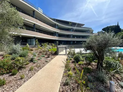 a building with a sidewalk in front of a garden at Fabron Hills By Avecoeur in Nice