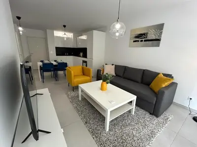 a living room with a couch and a table at Fabron Hills By Avecoeur in Nice