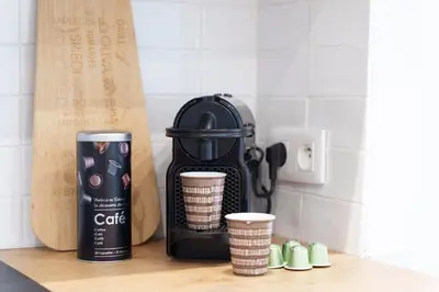 a coffee maker on a counter with cups on it at Nice Renting - BARBERIS - Unique Getaway 2-Room with Rooftop Terrace in Nice