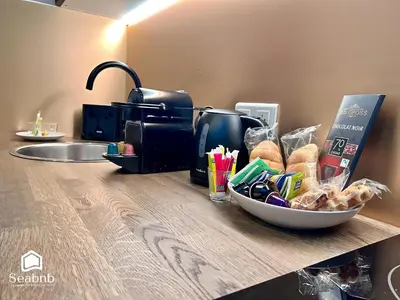 a counter top with a bowl of food and bread at Luxurious Apartment - Seaside - Spa Bath - WiFi - AC in Nice