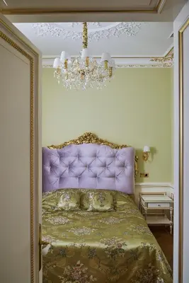 a bedroom with a bed with a purple head board at Maison des Barons in Nice