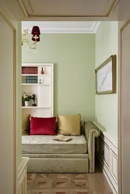 a living room with a couch with a red pillow at Maison des Barons in Nice