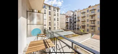 a balcony with a bench on the side of a building at Studio de luxe au cœur de Nice in Nice