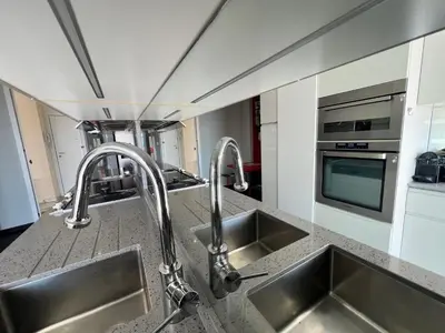 a kitchen with two sinks and two faucets at ApartHotel Riviera - TERRASSE DES AGAVES - Amazing Sea View Nice Côte d'Azur in Nice