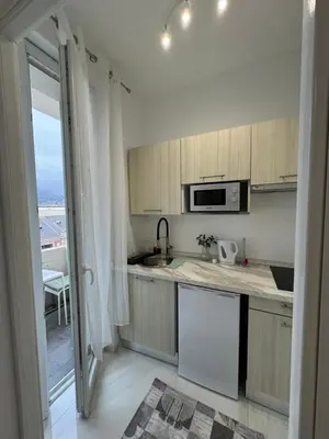 a kitchen with a sink and a microwave at Newly refurbished studio in Nice