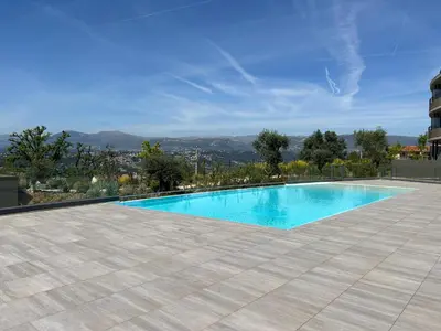 a swimming pool on the roof of a house at L'Oasis Maritime By Avecoeur in Nice