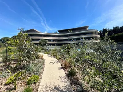 a building with a pathway in front of a building at L'Oasis Maritime By Avecoeur in Nice