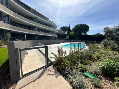 a swimming pool in front of a building at L'Oasis Maritime By Avecoeur in Nice