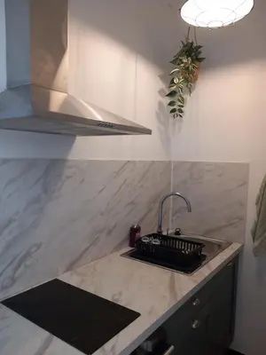 a kitchen with a sink and a counter top at Appartement cosy Nice in Nice