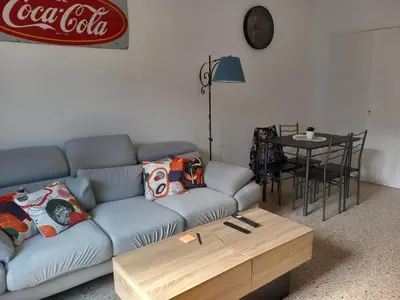 a living room with a couch and a coffee table at Appartement cosy Nice in Nice