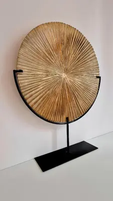 a large wooden fan on a stand on a wall at Jazzy et Spacieux Appartement Prom des Anglais in Nice