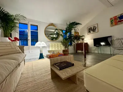 a living room with a couch and a table at Superbe duplex entre le Vieux Nice et la Prom in Nice
