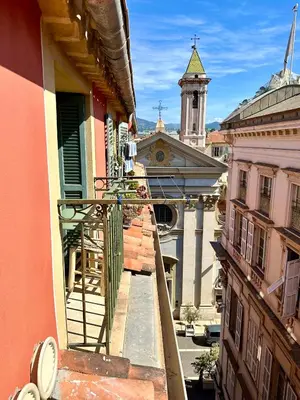 a view from a balcony of a building with a clock tower at Superbe duplex entre le Vieux Nice et la Prom in Nice