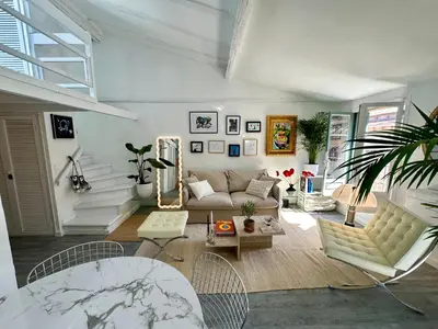 a living room with a couch and a table at Superbe duplex entre le Vieux Nice et la Prom in Nice