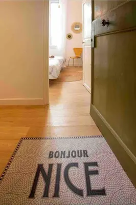 a door mat with the word on it in a room at nice-flat-nice in Nice