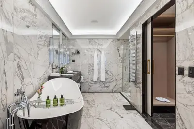 a bathroom with a tub and a sink at Maison Albar - Le Victoria in Nice