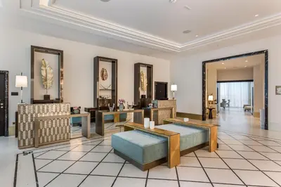a living room with tables and chairs in a room at Maison Albar - Le Victoria in Nice