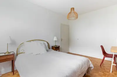 a bedroom with a bed and a desk and a chair at Happyfew Le Floreal in Nice
