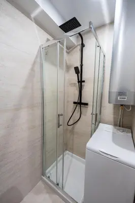a shower with a glass door in a bathroom at Studio idéalement situé résidence front de mer in Saint-Laurent-du-Var